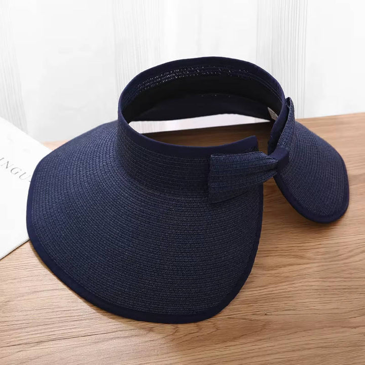 Stylish women's straw wide brim visor, perfect UPF 50 sun protection for beach, travel & summer outfits.