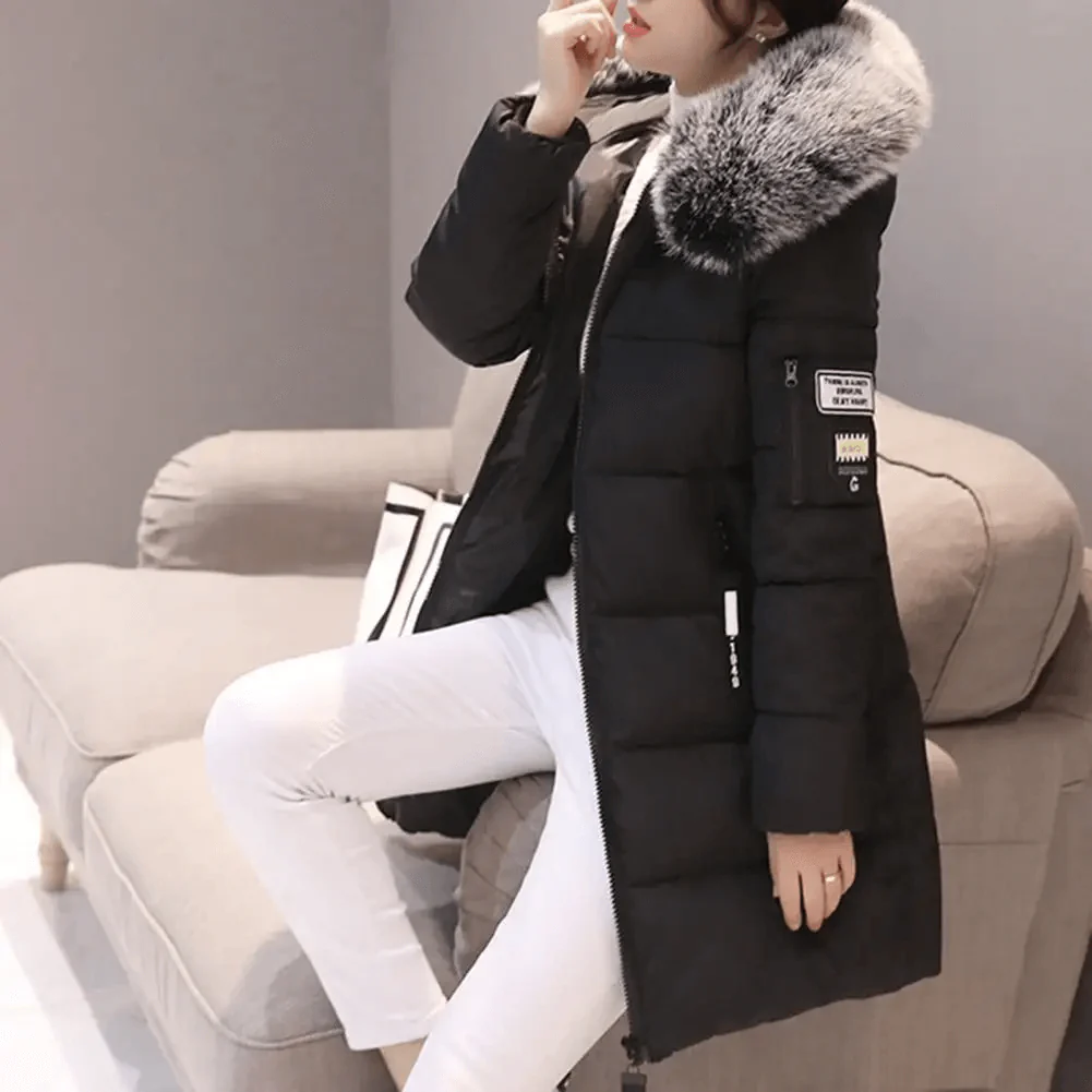 Oversized women's quilted puffer jacket with faux fur hood & ribbed cuffs. Warm, casual winter coat, plus size available.