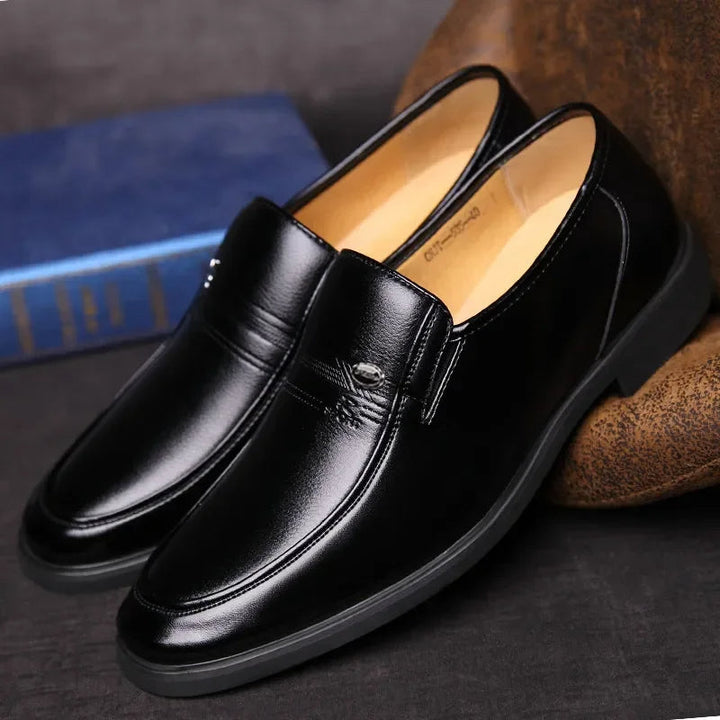 Men's professional black slip-on dress shoes. Classic style formal footwear for business meetings & occasions.