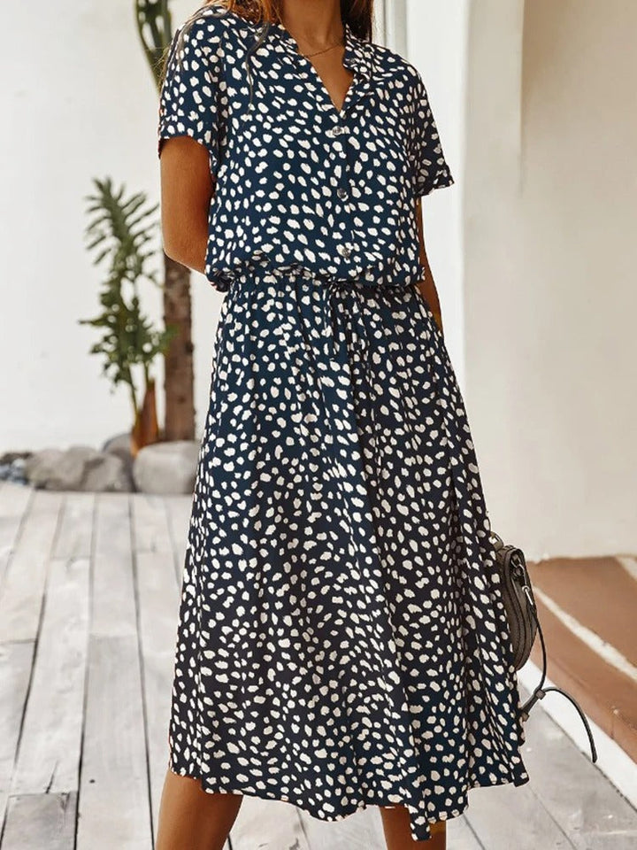 Women's elegant summer midi dress, lightweight & breathable, perfect for warm weather fashion.