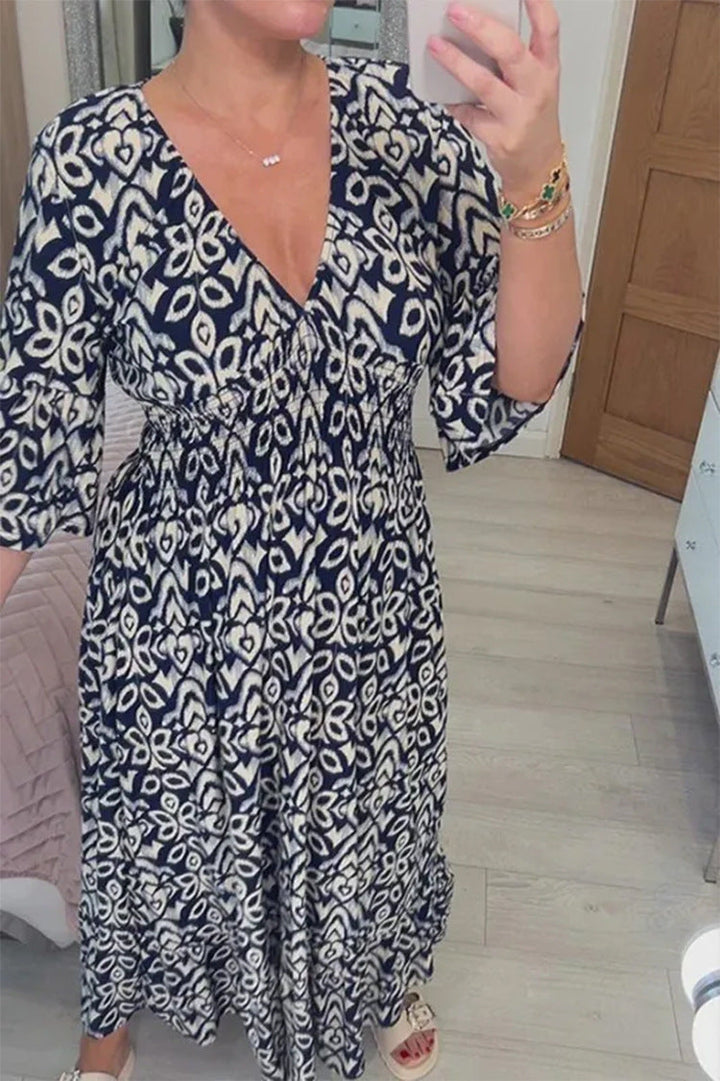 Comfortable women's printed maxi dress with a flattering V-neck and relaxed flowy style.