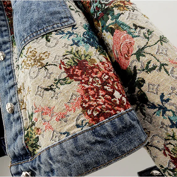 Spring fashion women's denim jacket with a beautiful hand-painted floral pattern. Casual and stylish outerwear.