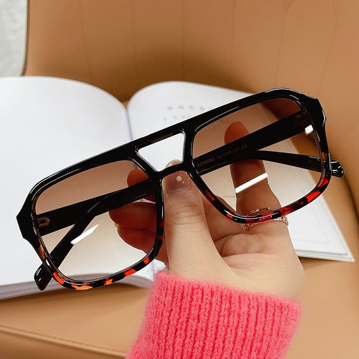 Vintage-style square candy sunglasses with reflective lenses for beach fashion.