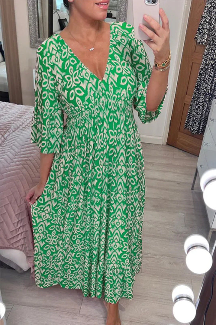 Chic women's flowy V-neck maxi dress with an eye-catching print, great for elegant events.