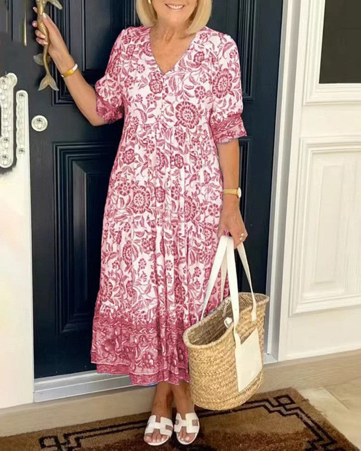 Stylish women's long V-neck maxi dress in a beautiful print, perfect for any occasion.
