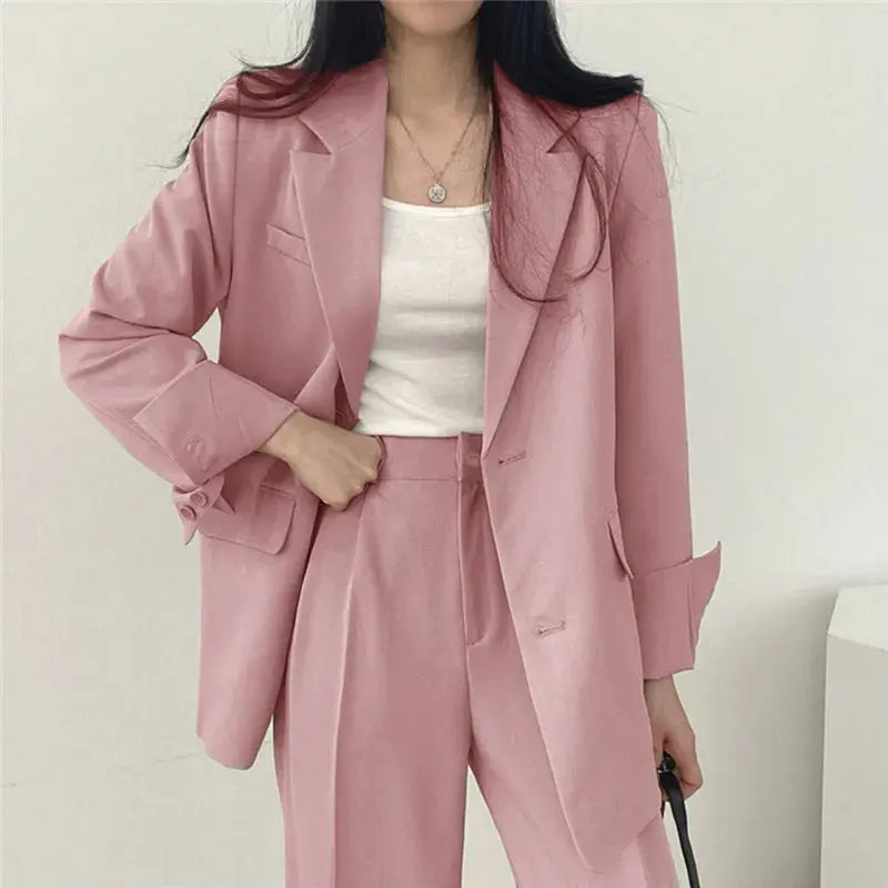 Women's elegant tailored blazer & trouser set, perfect business attire.