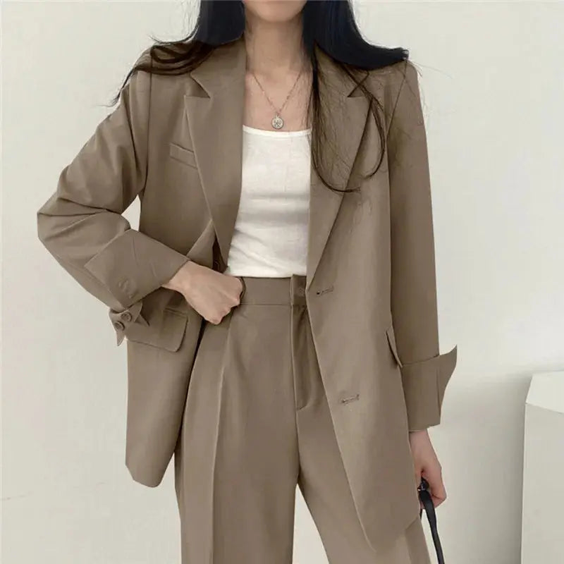 Close up of women's tailored blazer lapel, showcasing quality and elegant design.