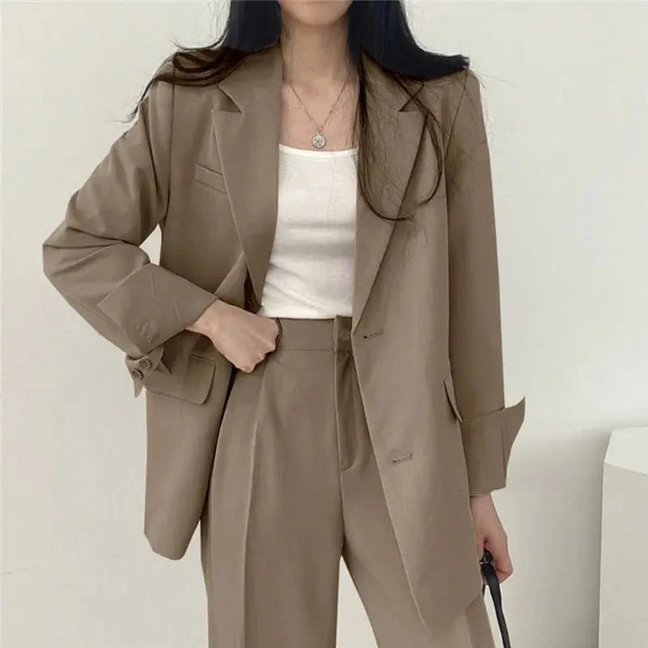 Close up of women's tailored blazer lapel, showcasing quality and elegant design.