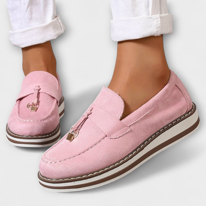 Stylish pink women's round toe loafers, perfect for adding a pop of color to any casual or formal outfit.