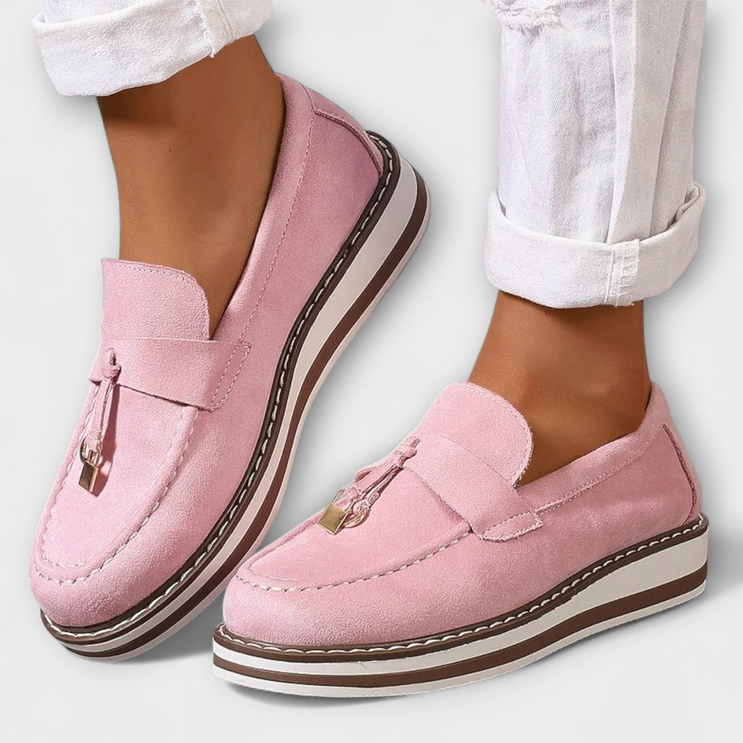 Women's classic round toe loafers in a versatile slip-on design, offering stylish comfort for daily wear.