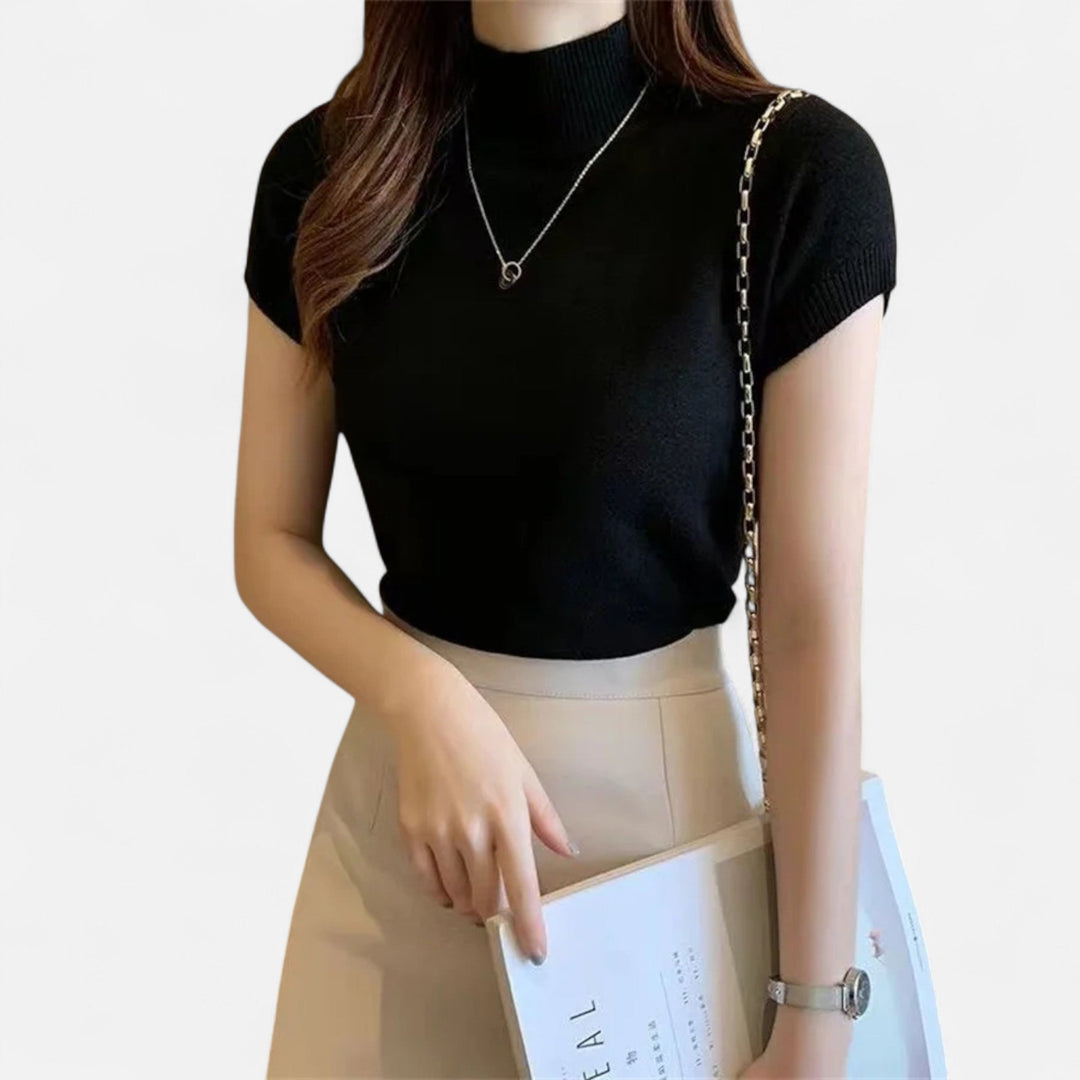 Soft knitted short-sleeve turtleneck blouse for women, blending casual comfort with elegant style.