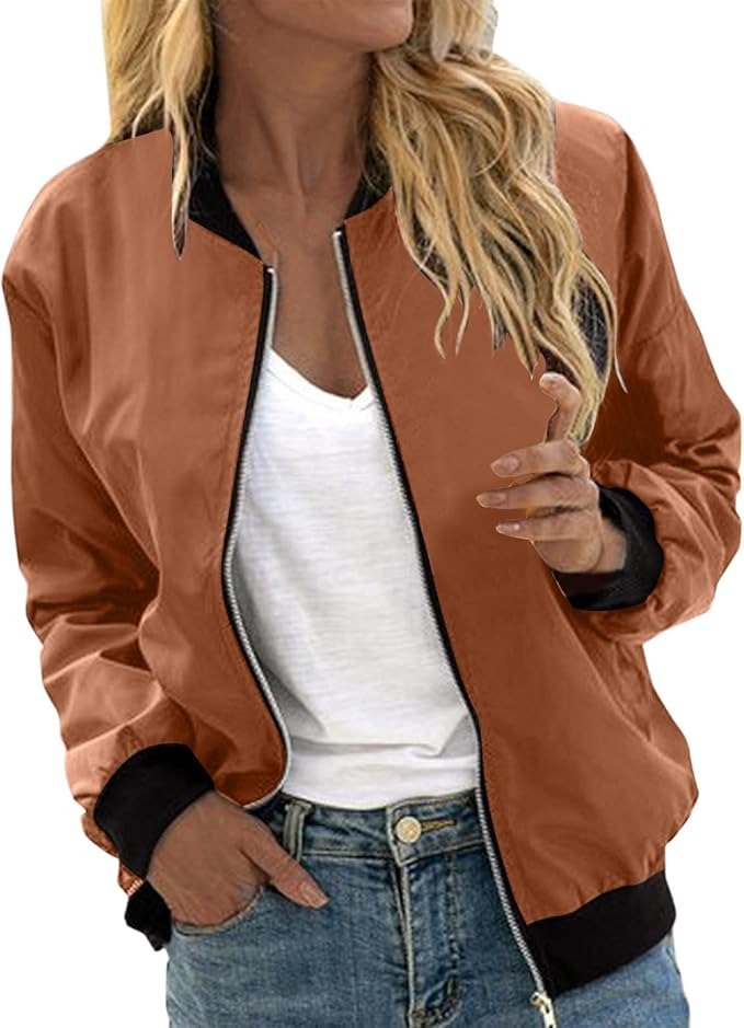 Vibrant floral print bomber jacket for women, fashionable patterned outerwear for a chic look.
