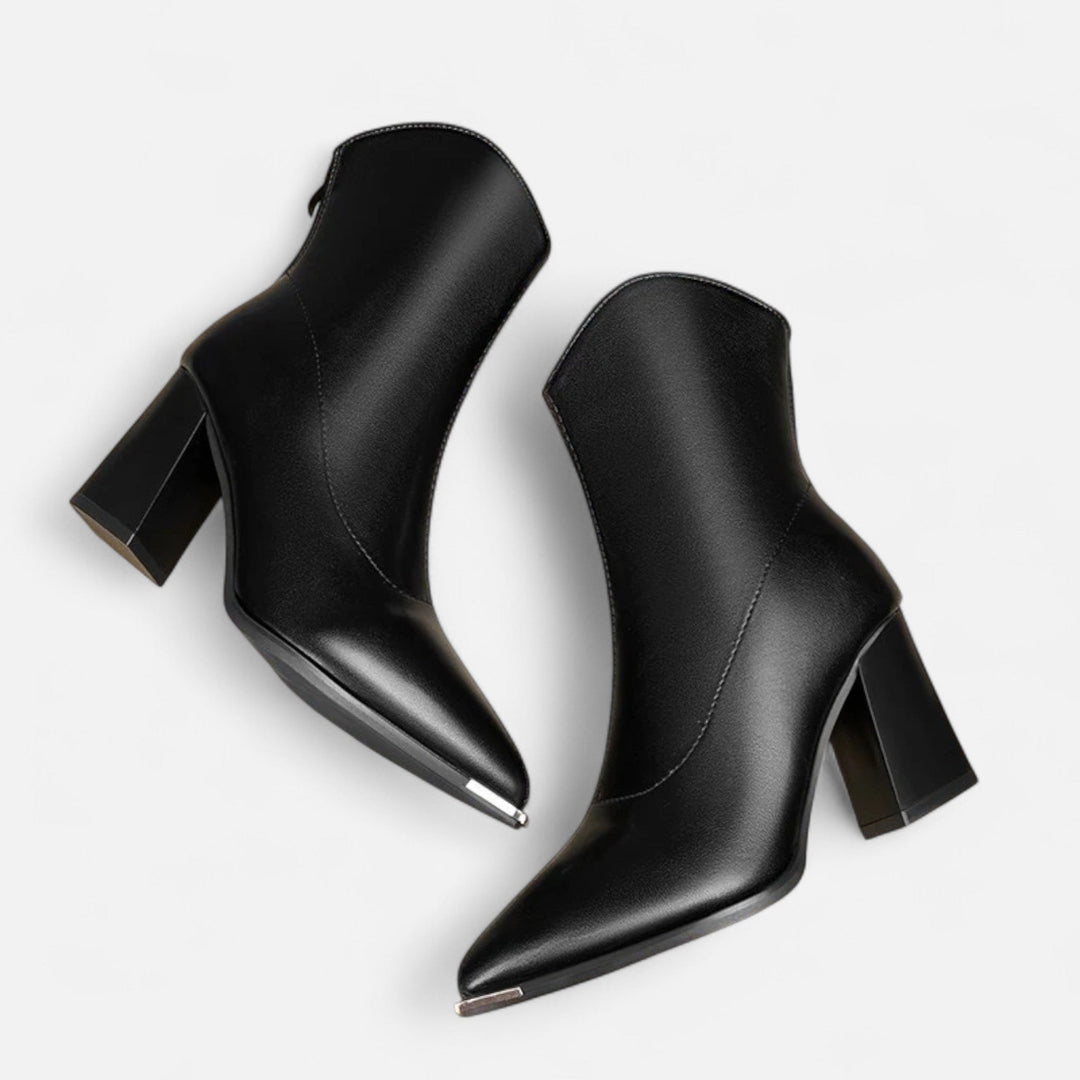 Versatile women's pointed-toe Chelsea ankle boots, ideal for both casual outfits and elegant dress wear. Slip-on style.