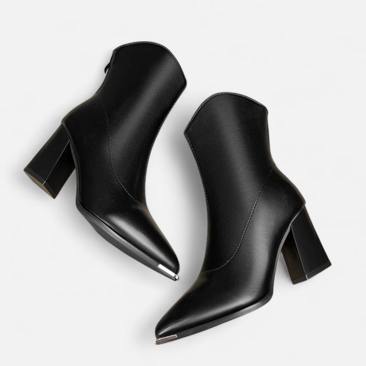 Versatile women's pointed-toe Chelsea ankle boots, ideal for both casual outfits and elegant dress wear. Slip-on style.