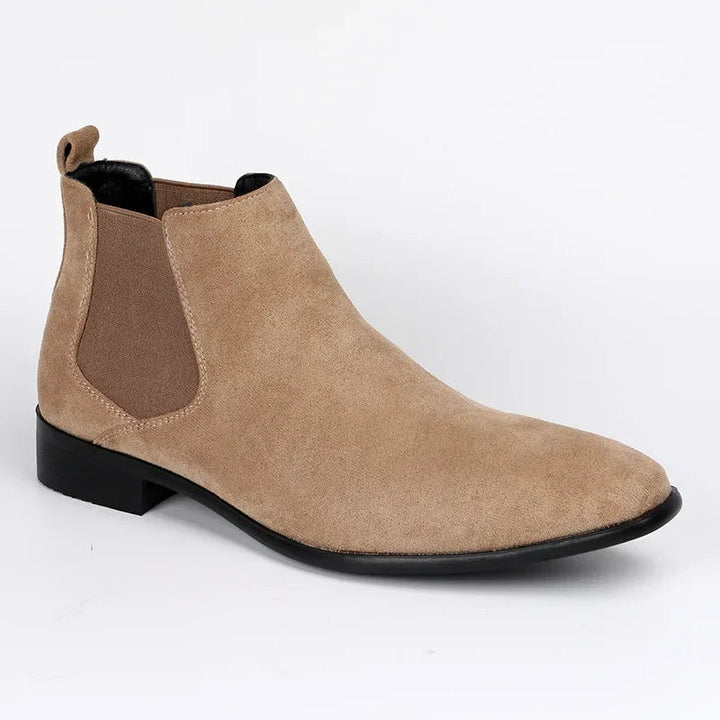 Men's black pull-on Chelsea ankle boots with pointed toe, perfect for stylish smart casual and dressy outfits.