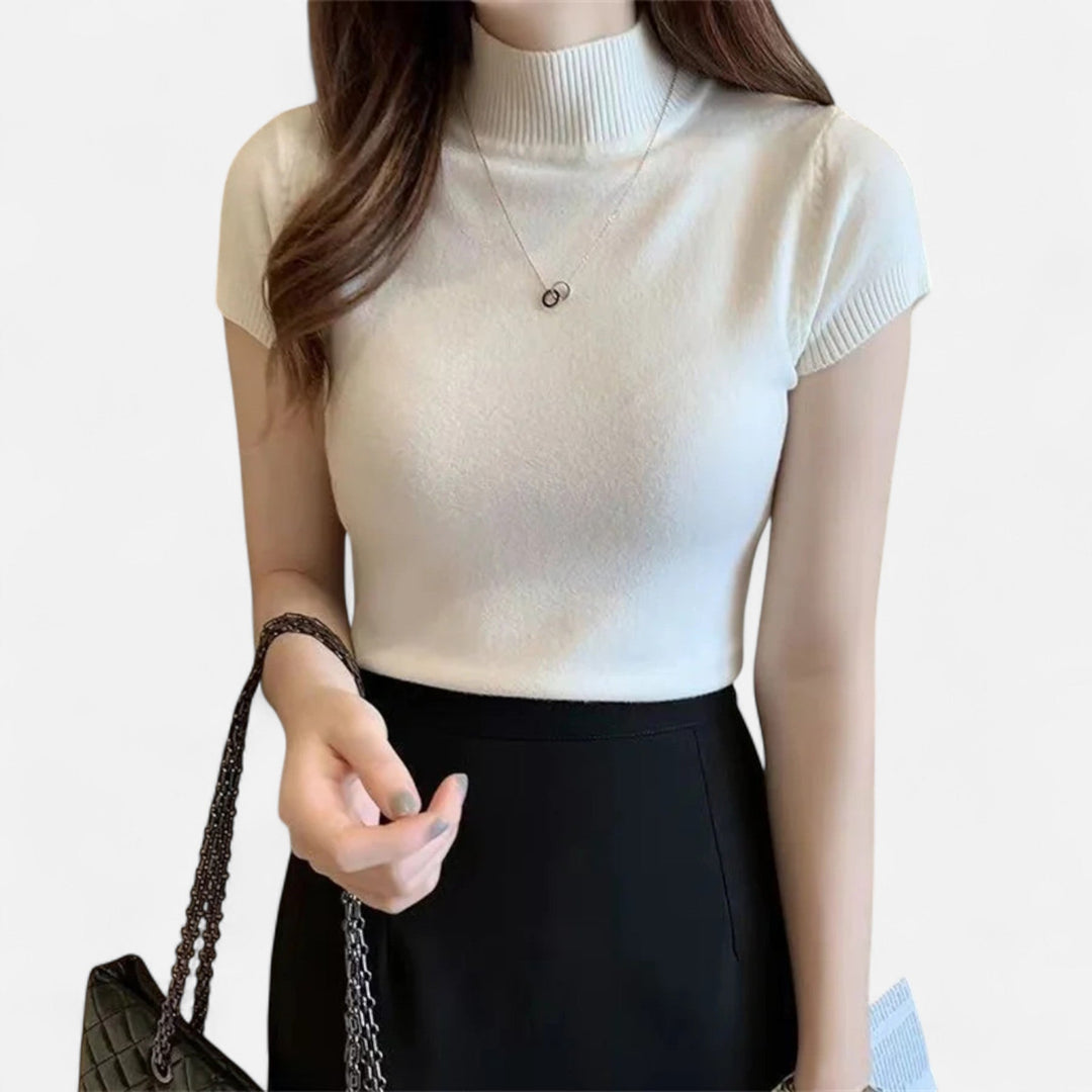 Sophisticated women's knitted turtleneck blouse, short-sleeve design for a chic & elegant appearance.