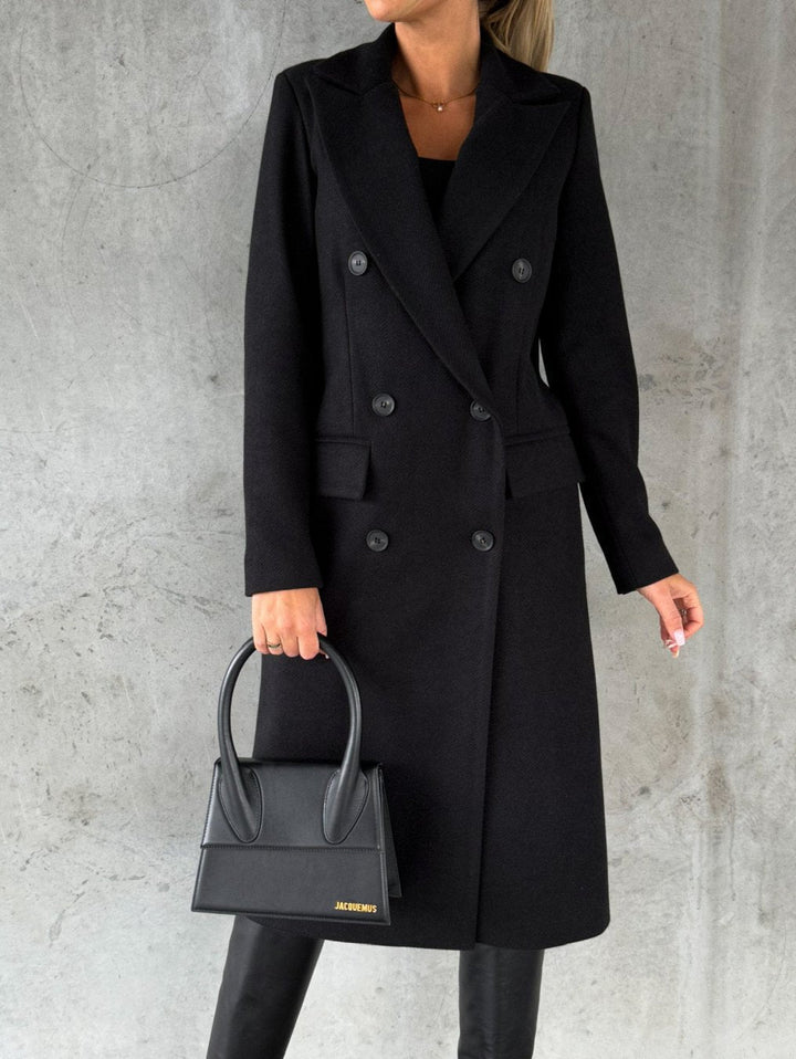 Warm women's winter jacket. Elegant double-breasted coat for stylish cold weather outerwear fashion.