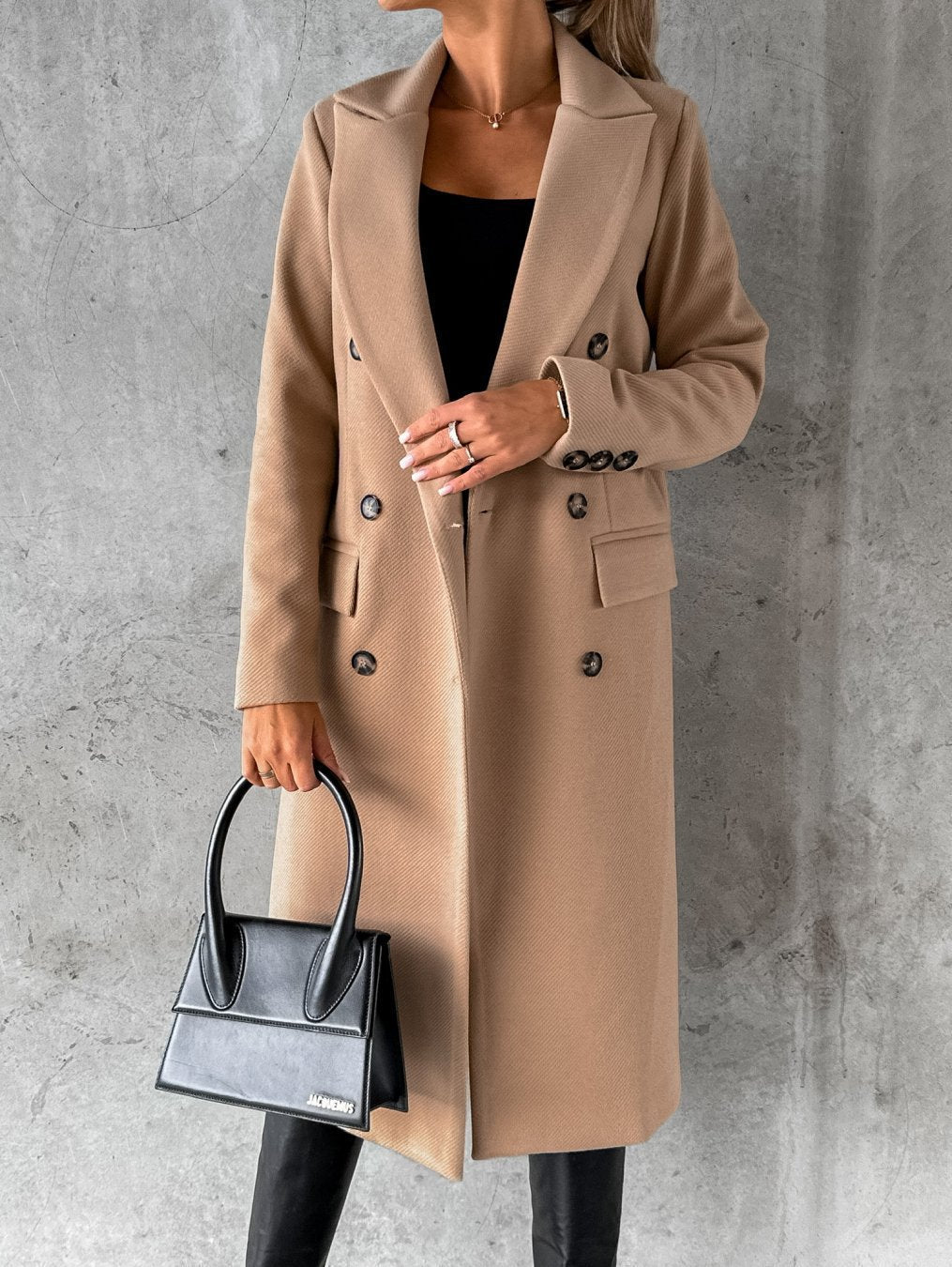 Fashionable women's elegant winter coat, a stylish and warm double-breasted outerwear piece for cold weather.