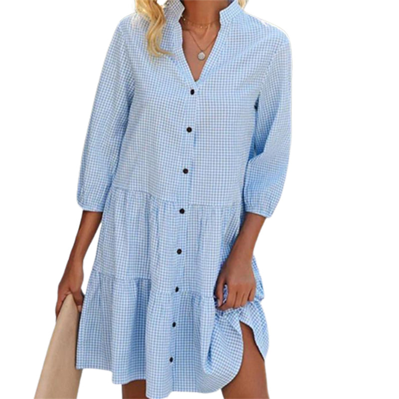 Fashionable women's checkered midi dress with a comfortable high neck. Ideal for elegant everyday wear.