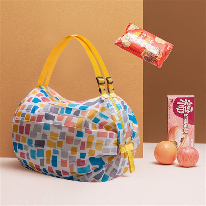 Reusable women's foldable tote bag for shopping, travel, and groceries; eco-friendly and spacious design.