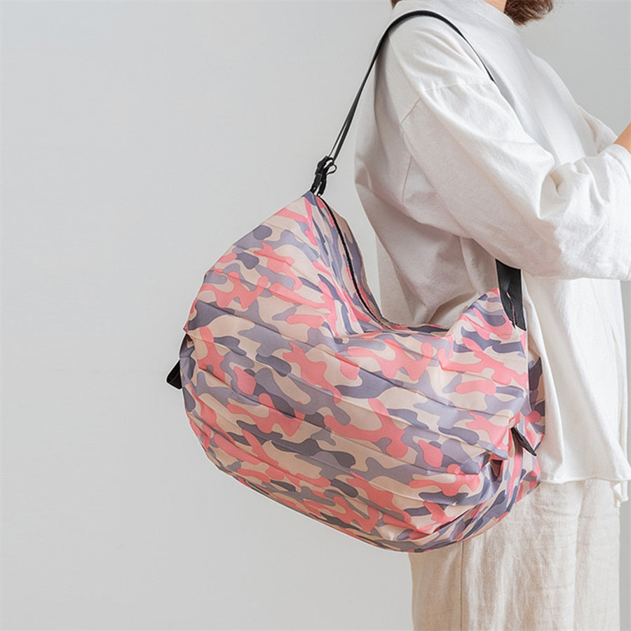 Lightweight, foldable women's travel tote bag; large capacity for shopping, groceries, or essentials.