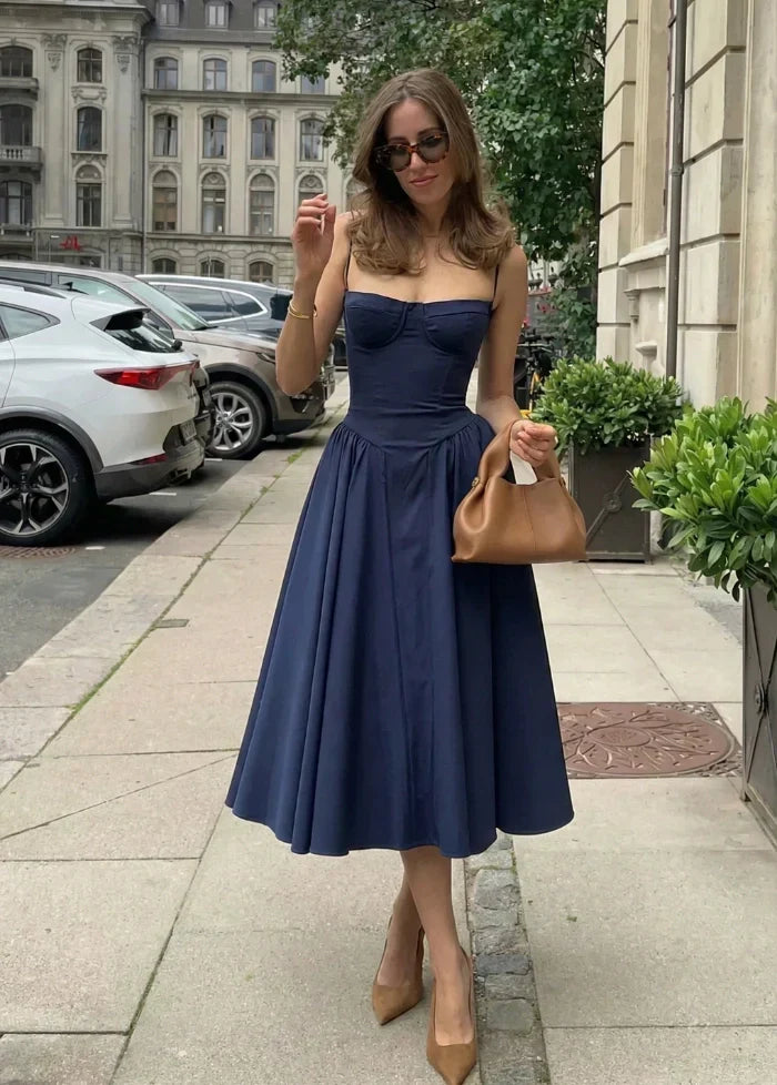 Women's elegant blue cocktail dress, a figure-hugging sculpted corset design for glamorous evenings.