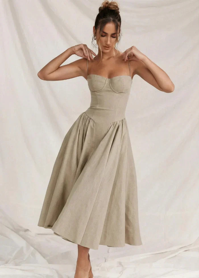 Chic beige bodycon corset dress, figure-hugging and sculpted, ideal for cocktail parties & evening events.