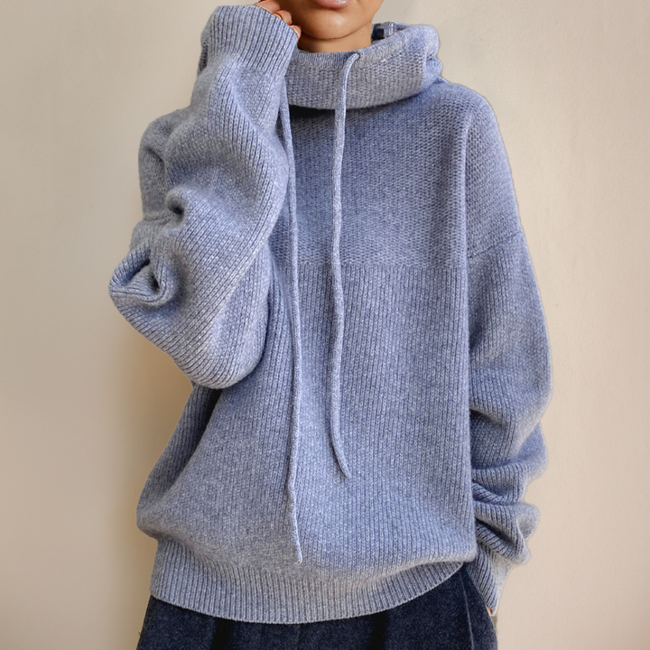 Stylish women's high-neck sweater, a cozy autumn fashion staple and elegant winter layering piece.