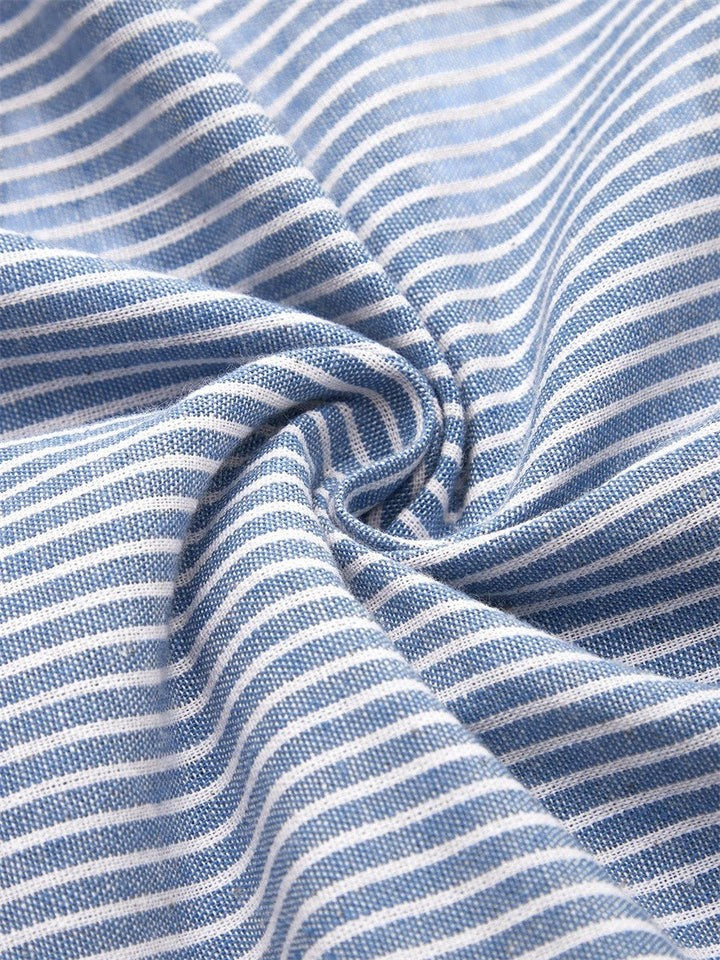 Comfortable women's striped summer midi dress, below-knee length, with stylish button accents and practical pockets.
