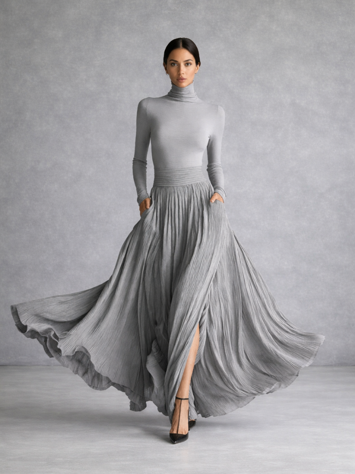 Women's elegant long sleeve turtleneck maxi dress with a stylish pleated skirt, suitable for formal occasions.