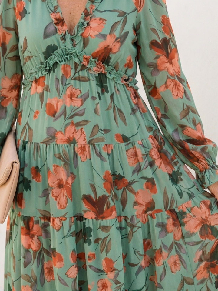 Elegant flowy long sleeve floral maxi dress for women, featuring a flattering V-neck, ideal for any occasion.