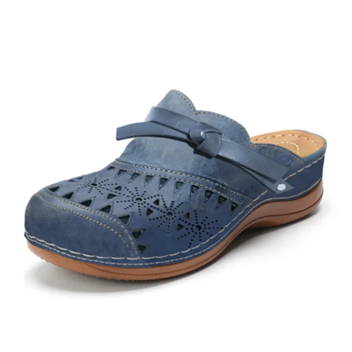 Breathable women's perforated clogs with arch support, ideal orthopedic mules for work or casual wear.