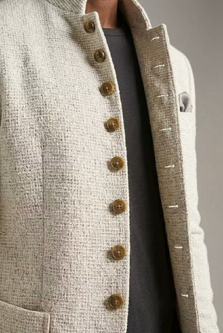Textured men's blazer, mandarin collar, versatile for smart casual or elegant evening fashion.