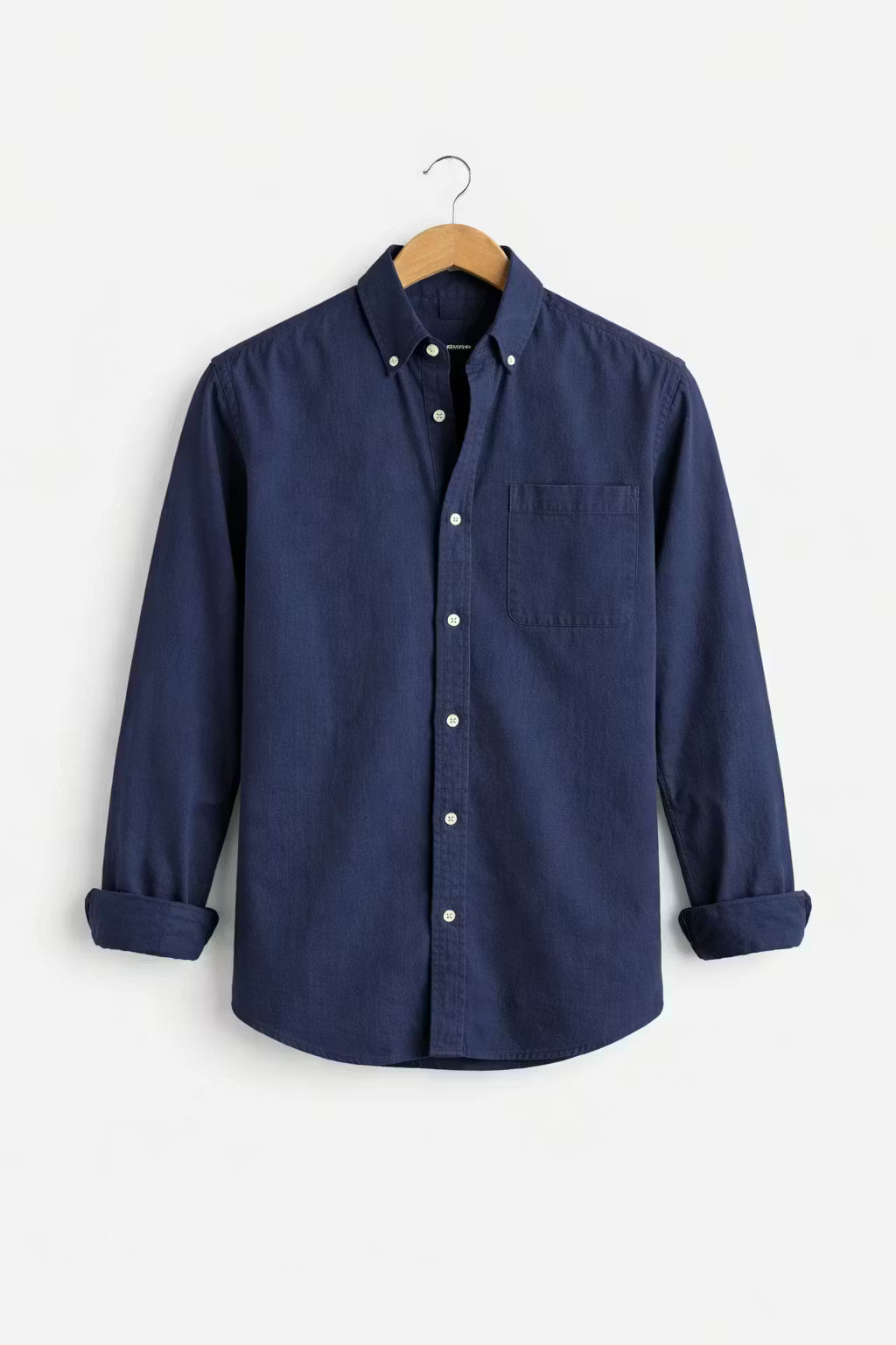 Men's relaxed fit chambray button-up shirt. Long sleeve design for effortless, comfortable casual wear.