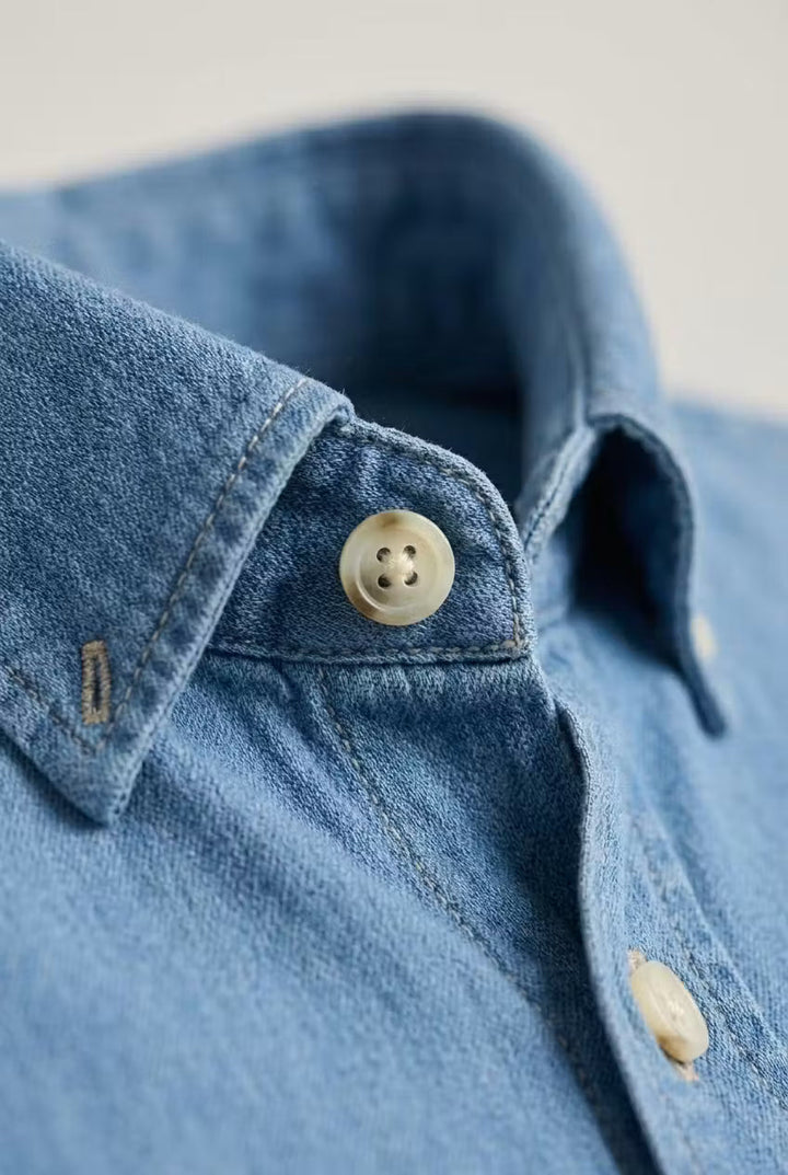 Stylish men's long sleeve chambray shirt. Relaxed fit button-up for casual, smart casual, and comfort.