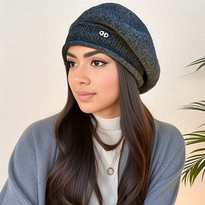 Modern chic knitted beret for women. Warm, soft hat, perfect for sophisticated winter style.