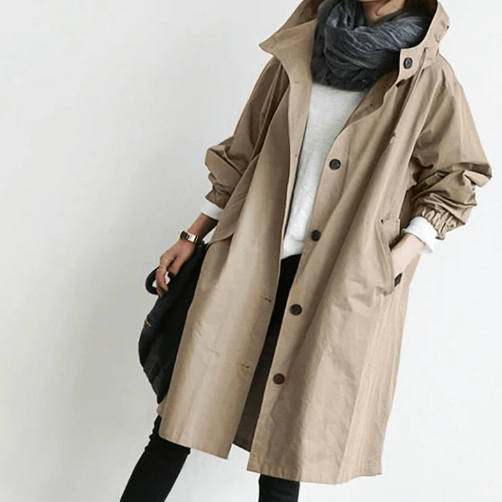 Women's stylish waterproof hooded jacket for all-weather protection and comfort.