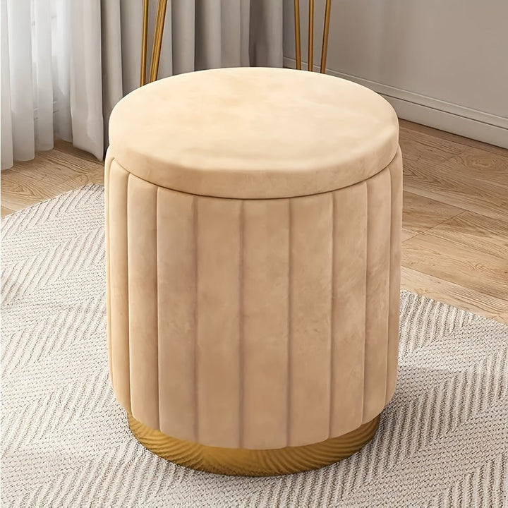 Stylish storage pouf, round design, mirrored base for bedroom or living room.