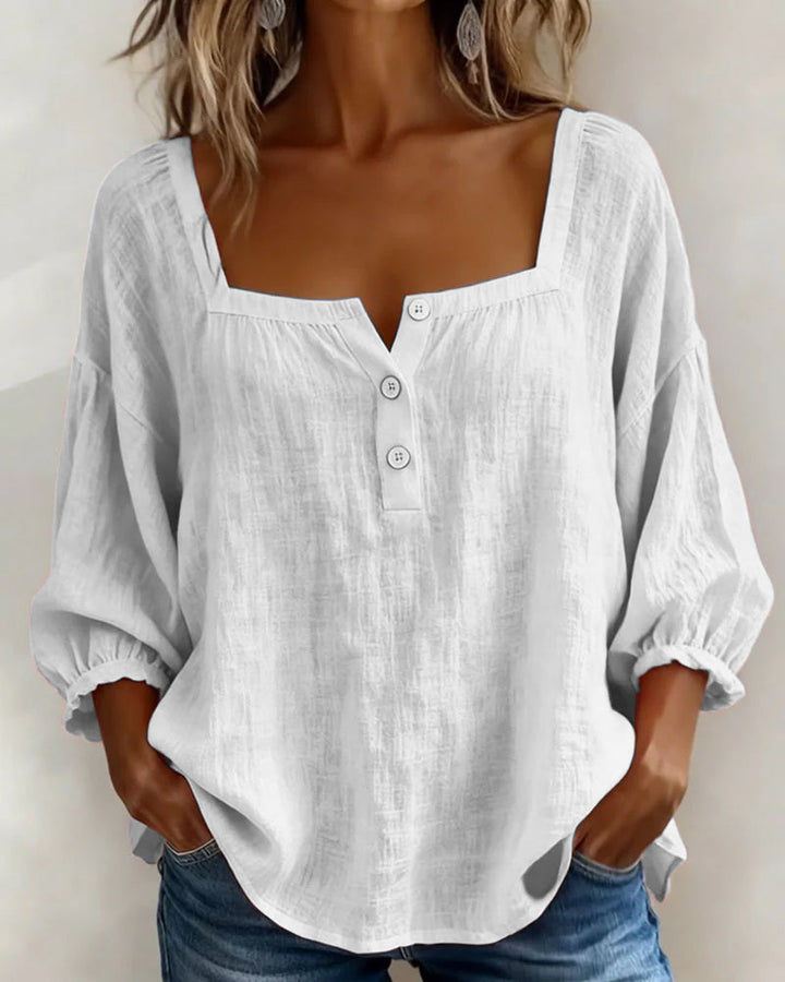Stylish women's blouse with comfortable relaxed fit & fashionable puff sleeves.