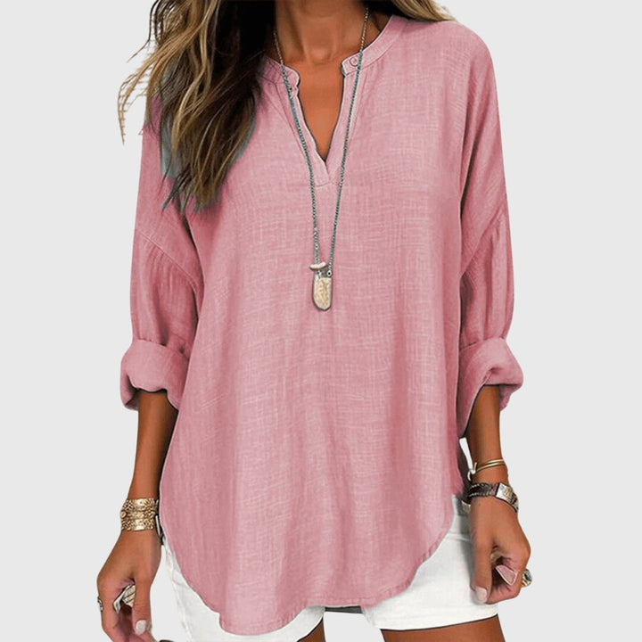Stylish women's summer beach shirt with a round neck, perfect for elegant resort wear.