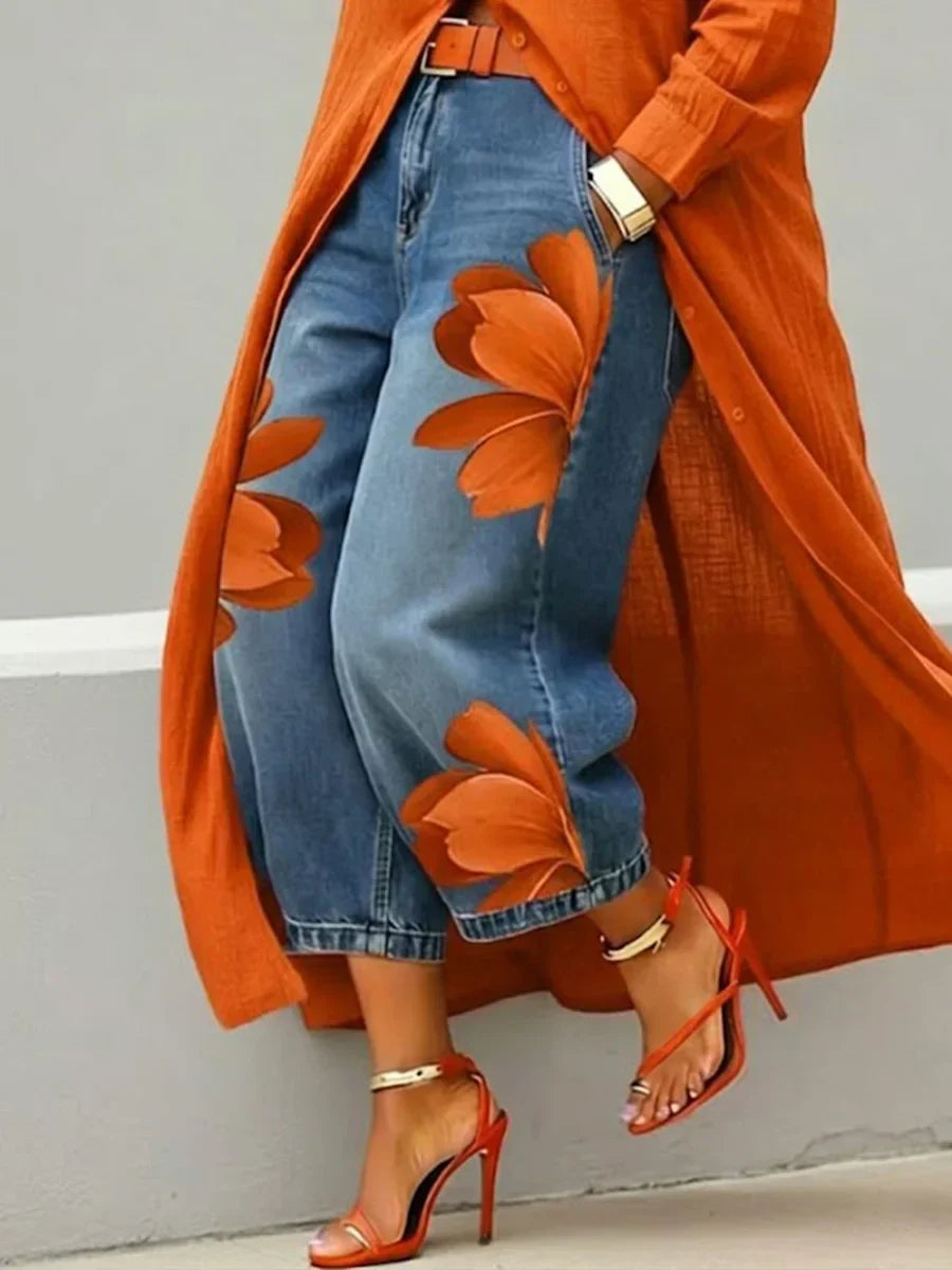 Statement women's attire: a sophisticated shirt dress paired with unique, vibrant floral design jeans.