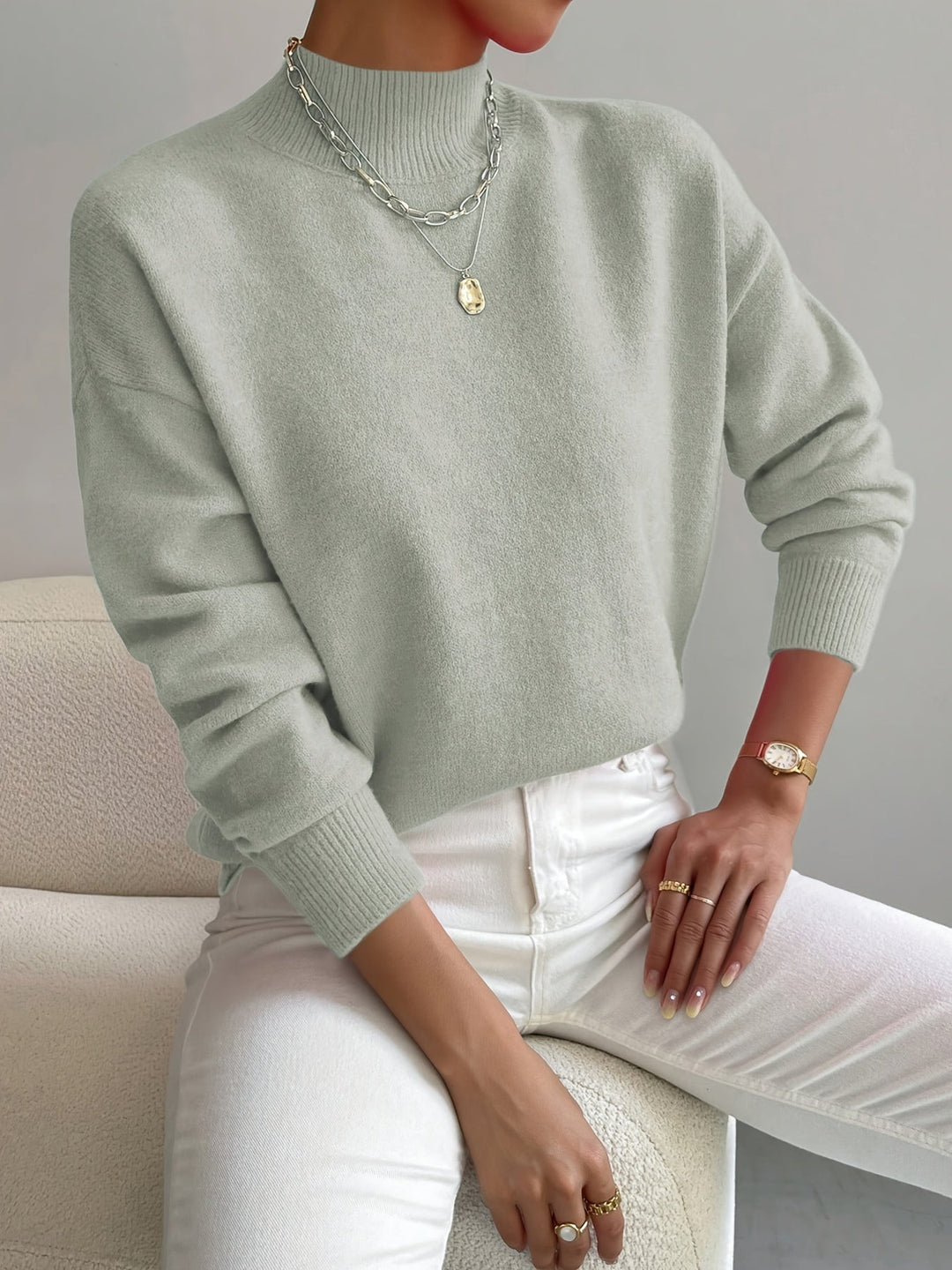 Warm long sleeve knitted jumper for women, ideal for autumn style.
