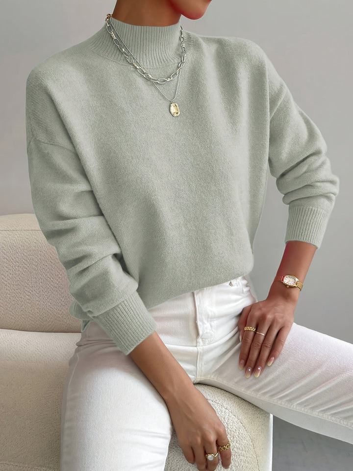 Warm long sleeve knitted jumper for women, ideal for autumn style.