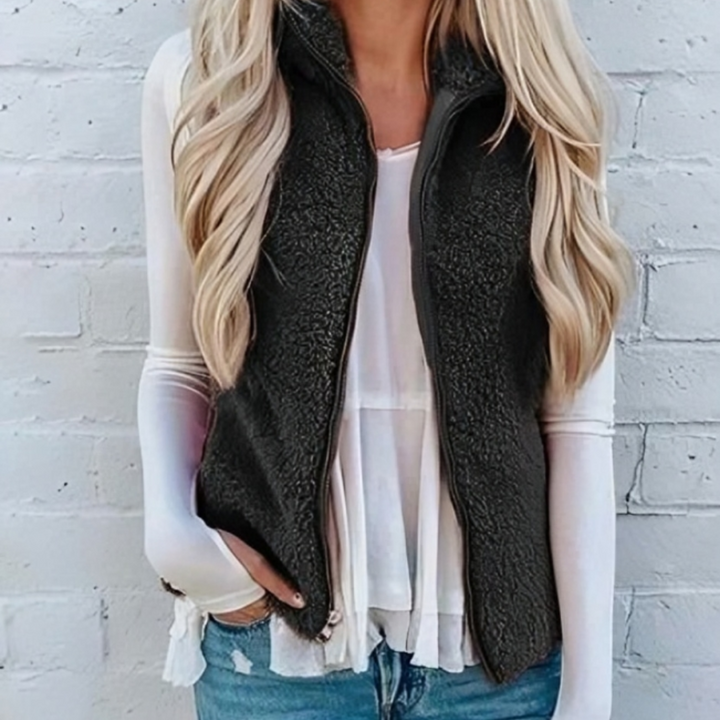Chic women's zippered fleece vest for layering. Lightweight and cozy, great for autumn casual wear.