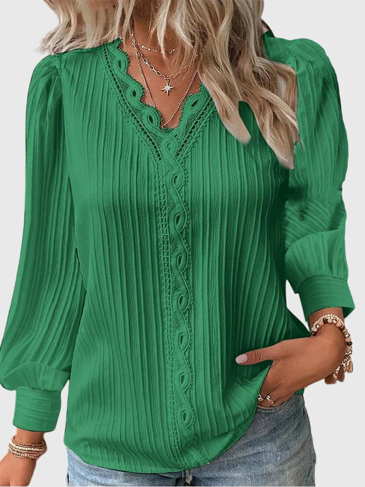 Stylish women's pullover blouse with round neck & long sleeves. Versatile for everyday or dressy occasions.
