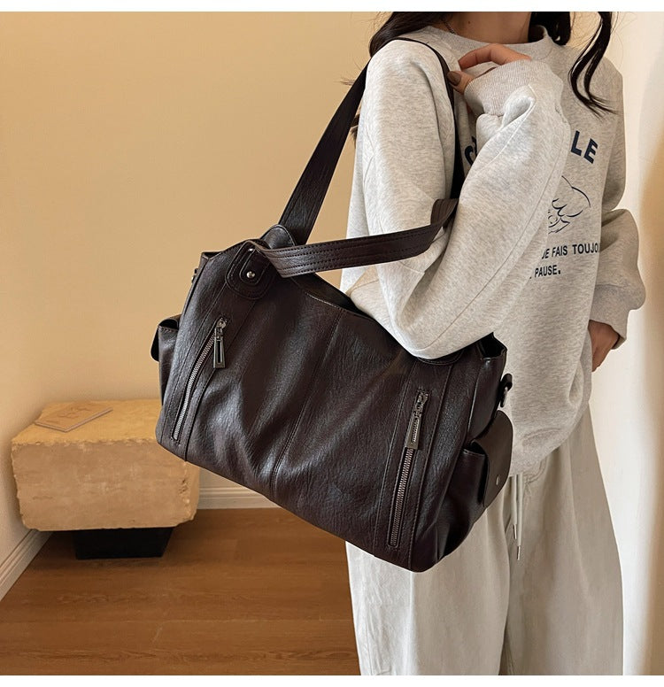Elegant brown women's vegan leather tote bag, ideal as a shoulder work bag or fashion accessory.