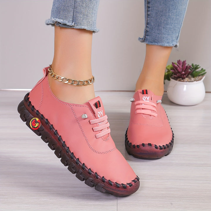 Interior of a women's slip-on round toe shoe, featuring soft lining for all-day comfort.