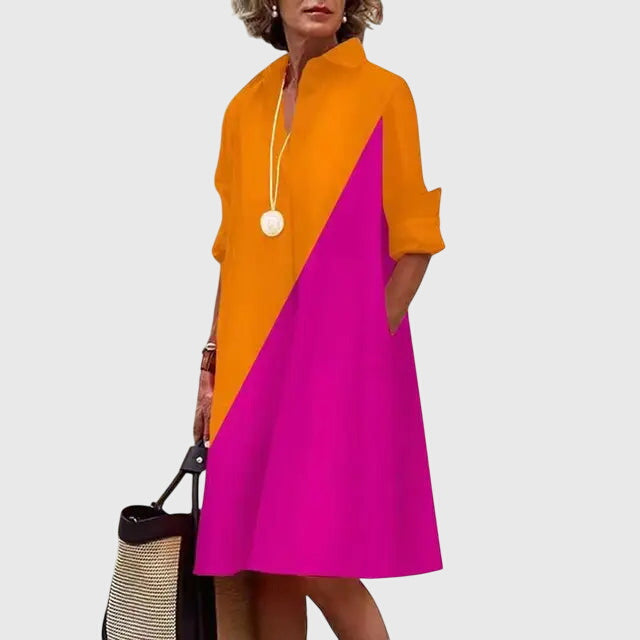 Neckline and sleeves detail of an elegant women's dress, showcasing chic and refined design.