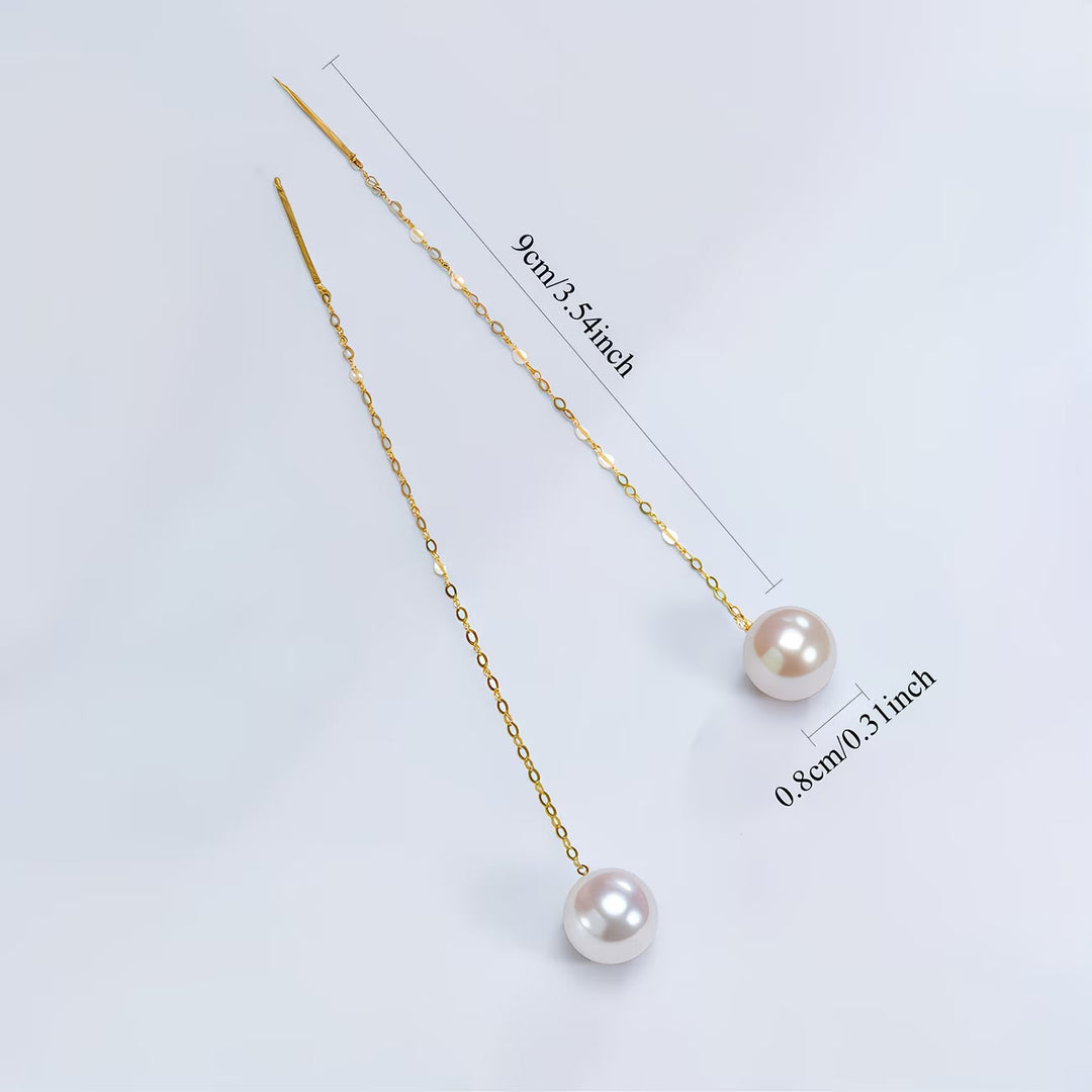 Stylish women's long pearl tassel earrings, perfect elegant dangle accessory for evening wear or special events.