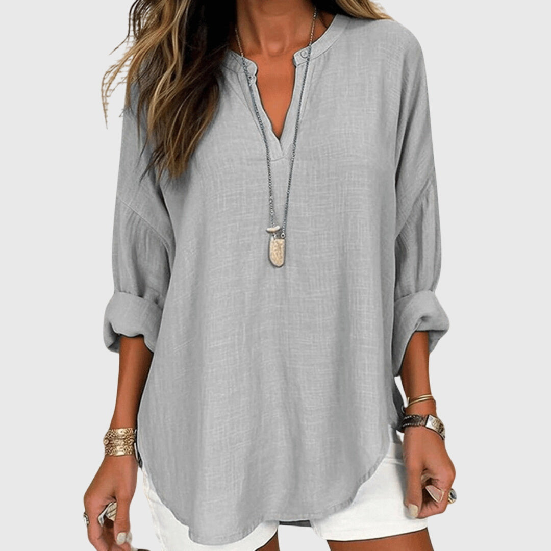 White flowing beach top for women, a comfortable and elegant long sleeve summer blouse.